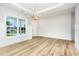 Dining room with decorative chandelier, wainscoting, and ample natural light at 162 Tuskeegee Dr, Smithfield, NC 27577