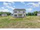 Backyard of a two-story home featuring a spacious backyard and a classic design at 162 Tuskeegee Dr, Smithfield, NC 27577