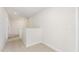 Upstairs hallway featuring carpeted floors, neutral paint and access to multiple rooms at 162 Tuskeegee Dr, Smithfield, NC 27577