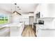 Bright kitchen with white cabinets, granite countertops, and a large island at 162 Tuskeegee Dr, Smithfield, NC 27577