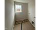 Functional laundry room features a window for natural light, ready for appliances and finishing at 162 Tuskeegee Dr, Smithfield, NC 27577