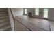 Open-concept living room with fireplace, large windows, and a door leading to the outside at 162 Tuskeegee Dr, Smithfield, NC 27577