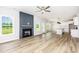Spacious living room featuring a fireplace, wood flooring, and abundant natural light at 162 Tuskeegee Dr, Smithfield, NC 27577