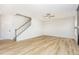 Open-concept living area with light wood floors and staircase at 162 Tuskeegee Dr, Smithfield, NC 27577