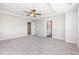 Spacious main bedroom with carpeted floors, tray ceiling with fan and an ensuite bathroom at 162 Tuskeegee Dr, Smithfield, NC 27577