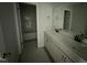 Well-lit bathroom featuring a double sink vanity and a combined shower and tub at 188 Tuskeegee Dr, Smithfield, NC 27577