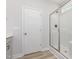 Bathroom with a glass-enclosed shower, white cabinets, and contemporary fixtures for a sleek design at 188 Tuskeegee Dr, Smithfield, NC 27577