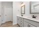 Bathroom featuring dual vanities with gray cabinets, quartz countertops, and modern fixtures at 188 Tuskeegee Dr, Smithfield, NC 27577