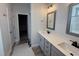 Bathroom with double sink vanity, modern fixtures, and a framed mirror at 188 Tuskeegee Dr, Smithfield, NC 27577