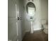 Powder room with a modern pedestal sink and toilet at 188 Tuskeegee Dr, Smithfield, NC 27577