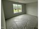 Bedroom featuring a window providing ample natural light, neutral walls, and carpeted floors at 188 Tuskeegee Dr, Smithfield, NC 27577