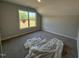 Bedroom with a large window offering natural light and a view of the land outside at 188 Tuskeegee Dr, Smithfield, NC 27577