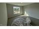 Bedroom with neutral paint and carpet offering natural light from a window at 188 Tuskeegee Dr, Smithfield, NC 27577