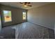 Bedroom with neutral paint, carpet, and natural light from two windows at 188 Tuskeegee Dr, Smithfield, NC 27577