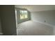Bright bedroom with a large window, ready for personalization and furnishing at 188 Tuskeegee Dr, Smithfield, NC 27577