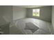Upstairs bonus room featuring neutral walls, a window, and carpeted floors at 188 Tuskeegee Dr, Smithfield, NC 27577