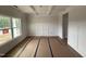A spacious dining room featuring detailed wall trim and a large window at 188 Tuskeegee Dr, Smithfield, NC 27577