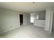 Spacious hallway featuring neutral walls and trim, with access to unfinished attic space at 188 Tuskeegee Dr, Smithfield, NC 27577