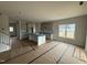 Bright open concept kitchen design with central island and ample lighting at 188 Tuskeegee Dr, Smithfield, NC 27577