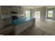 Stylish kitchen featuring modern cabinetry, a large island with a sink, and stainless steel appliances at 188 Tuskeegee Dr, Smithfield, NC 27577