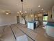 Spacious kitchen with center island, modern appliances, and an open view of the staircase at 188 Tuskeegee Dr, Smithfield, NC 27577