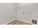 Functional laundry room with wire shelving for storage and convenient hookups for appliances at 188 Tuskeegee Dr, Smithfield, NC 27577