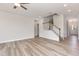 Spacious living room with wood floors, neutral walls, and staircase at 188 Tuskeegee Dr, Smithfield, NC 27577
