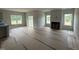 Open-plan living room with fireplace and large windows facing a view at 188 Tuskeegee Dr, Smithfield, NC 27577