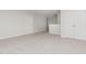 Spacious loft area with neutral carpet, white trim, and a closet for versatile living space at 188 Tuskeegee Dr, Smithfield, NC 27577