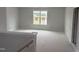 Loft space with natural light from a large window, offering a versatile area at 188 Tuskeegee Dr, Smithfield, NC 27577
