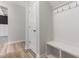 A mudroom featuring built-in bench seating, coat hooks, and open storage, perfect for organization at 188 Tuskeegee Dr, Smithfield, NC 27577