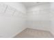 Spacious walk-in closet with multiple tiers of wire shelving, offering ample storage space at 188 Tuskeegee Dr, Smithfield, NC 27577