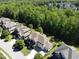 Aerial view of a beautiful home nestled in a lush, green neighborhood at 1927 Napoli Dr, Apex, NC 27502