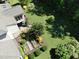 Aerial view of backyard with well maintained garden and patio space at 1927 Napoli Dr, Apex, NC 27502