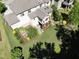 Aerial view of the backyard with lush lawn, garden, and patio area at 1927 Napoli Dr, Apex, NC 27502