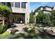 Charming patio and landscaped garden with lush plantings and a serene water feature at 1927 Napoli Dr, Apex, NC 27502