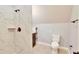 Bright bathroom with tiled shower, toilet, and vanity with convenient storage at 1927 Napoli Dr, Apex, NC 27502