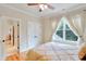 Comfortable bedroom with hardwood floors, walk-in closet, and lots of natural light at 1927 Napoli Dr, Apex, NC 27502