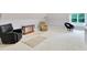 Large bonus room with seating arrangements, neutral carpet and window with seat at 1927 Napoli Dr, Apex, NC 27502