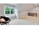 Bonus room with window bench, wet bar, neutral carpet and spacious layout at 1927 Napoli Dr, Apex, NC 27502