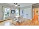 Cozy dining area with bright windows, ceiling fan and white trim at 1927 Napoli Dr, Apex, NC 27502