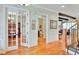 Beautiful foyer leading to living spaces, featuring hardwood floors and trim at 1927 Napoli Dr, Apex, NC 27502