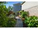 Beautiful backyard garden with raised beds and lush greenery, enclosed by a wooden fence at 1927 Napoli Dr, Apex, NC 27502