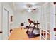 Home gym featuring exercise equipment, hardwood floors and recessed lighting at 1927 Napoli Dr, Apex, NC 27502