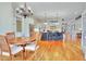 Bright, open kitchen with white cabinets, stainless steel appliances, and a central island with bar seating at 1927 Napoli Dr, Apex, NC 27502