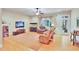 Spacious living room with hardwood floors, ceiling fan, and ample seating at 1927 Napoli Dr, Apex, NC 27502