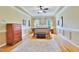 Serene main bedroom with hardwood floors, tray ceiling, and soothing colors offers a relaxing retreat at 1927 Napoli Dr, Apex, NC 27502