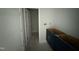 Bathroom with neutral colored walls, vanity with storage, and open doorway at 202 Tuskeegee Dr, Smithfield, NC 27577
