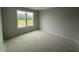 Bedroom with natural lighting from one window; under construction at 202 Tuskeegee Dr, Smithfield, NC 27577