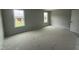 Bedroom featuring two windows and a door, offering ample natural light and easy access at 202 Tuskeegee Dr, Smithfield, NC 27577